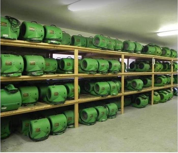 SERVPRO drying equipment stacked inside warehouse